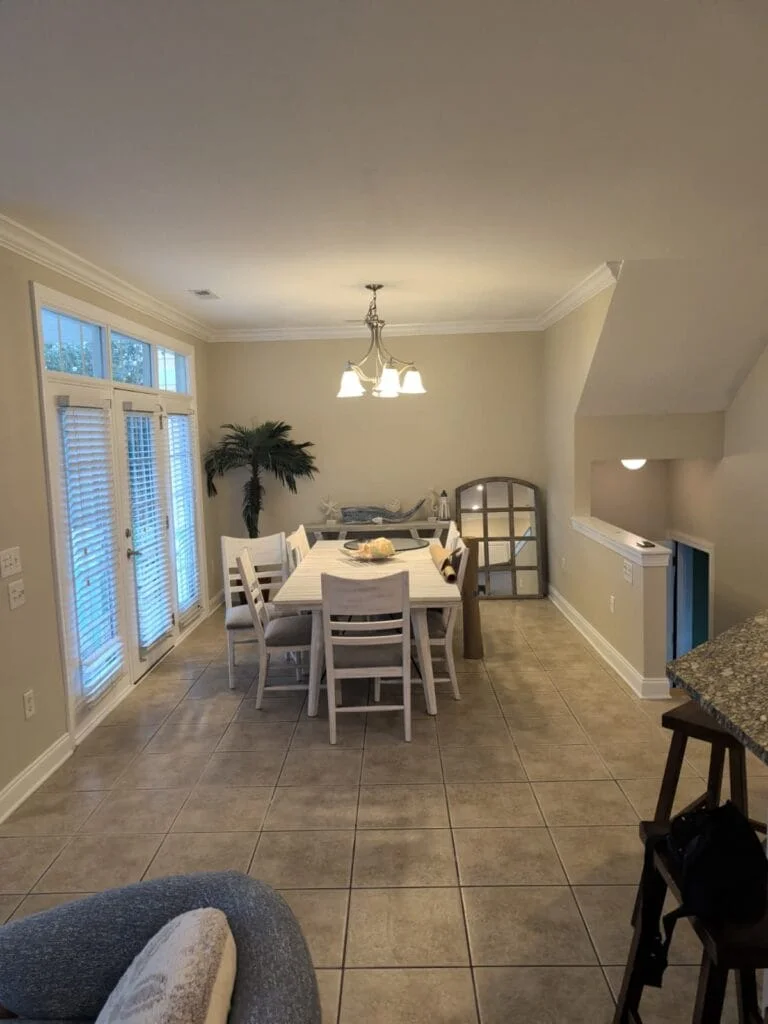 Soft neutral walls, tiled floors and light from the adjoining windows.